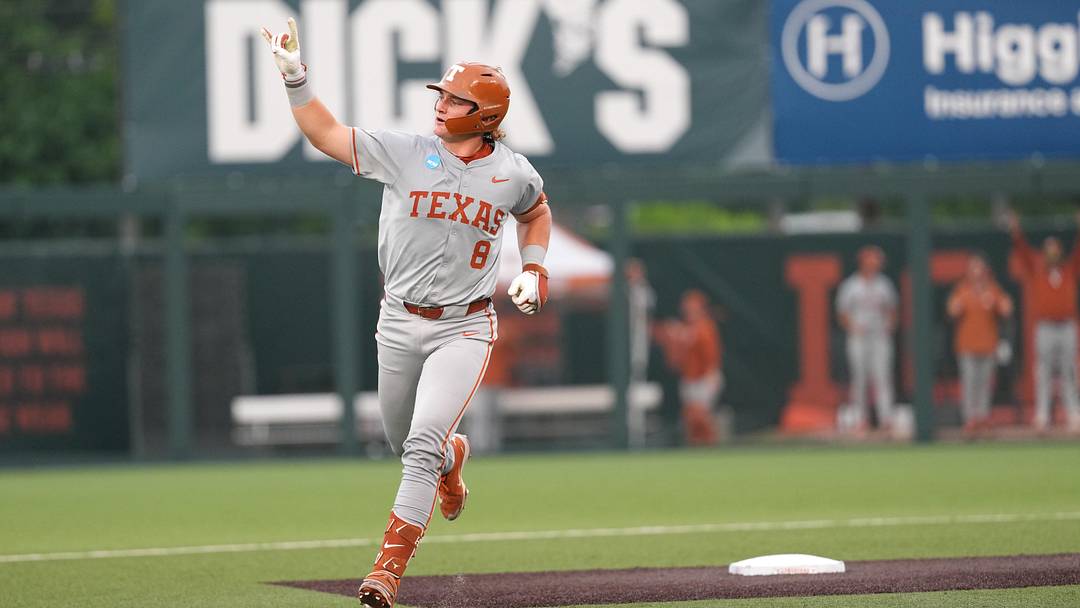 Texas Longhorns catcher Carson Tinney throws up the Hook 'Em Horns after hitting a home run against the Oregon Ducks in the Austin Super Regional.
