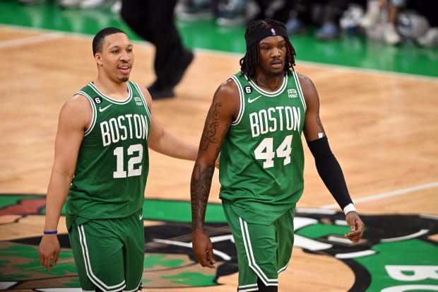 Boston Celtics center Robert Williams III (44) and forward Grant Williams (12) walk down court in a game vs. the Miami Heat.