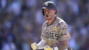 San Diego Padres center fielder Jackson Merrill celebrates on the field after hitting a walk-off home run against the New York Mets.