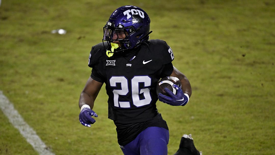 Nov 29, 2025; Fort Worth, Texas, USA; TCU Horned Frogs running back Jeremy Payne (26) runs with the ball against the Cincinnati Bearcats during the second half at Amon G. Carter Stadium. Mandatory Credit: Jerome Miron-Imagn Images Nov 29, 2025; Fort Worth, Texas, USA; TCU Horned Frogs running back Jeremy Payne (26) runs with the ball against the Cincinnati Bearcats during the second half at Amon G. Carter Stadium. Mandatory Credit: Jerome Miron-Imagn Images