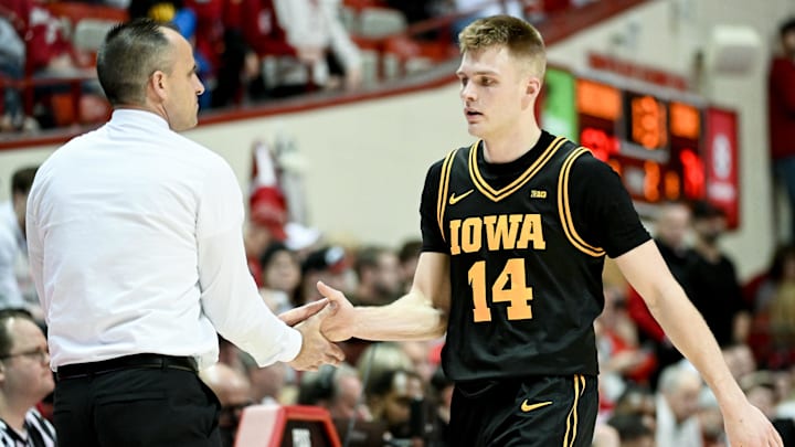 Jan 17, 2026; Bloomington, Indiana, USA; Iowa Hawkeyes guard Bennett Stirtz (14) greets Iowa Hawkeyes head coach Ben McCollum during the second half at Simon Skjodt Assembly Hall. Mandatory Credit: Robert Goddin-Imagn Images