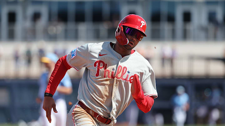Feb 25, 2025; Port Charlotte, Florida, USA;  Philadelphia Phillies outfielder Justin Crawford (80) runs home to score against the Tampa Bay Rays during the fourth inning at Charlotte Sports Park.