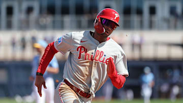 Feb 25, 2025; Port Charlotte, Florida, USA;  Philadelphia Phillies outfielder Justin Crawford (80) runs home to score against the Tampa Bay Rays during the fourth inning at Charlotte Sports Park.