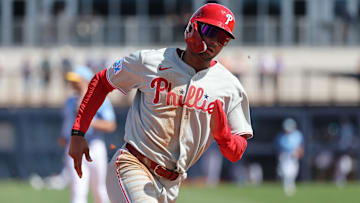 Feb 25, 2025; Port Charlotte, Florida, USA;  Philadelphia Phillies outfielder Justin Crawford (80) runs home to score against the Tampa Bay Rays during the fourth inning at Charlotte Sports Park.