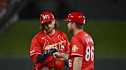Sep 19, 2025; St. Louis, Missouri, USA;  St. Louis Cardinals second baseman Brendan Donovan (33) celebrate with first base coach Packy Elkins (86)after hitting a single against the Milwaukee Brewers during the fifth inning at Busch Stadium. Mandatory Credit: Jeff Curry-Imagn Images