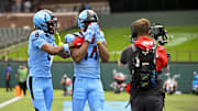 Mar 30, 2024; Arlington, TX, USA; Arlington Renegades defensive back Delonte Hood (14) and wide receiver Isaiah Winstead (14) celebrate after Winstead catches a pass for a touchdown against the Birmingham Stallions during the first half at Choctaw Stadium. Mandatory Credit: Jerome Miron-Imagn Images