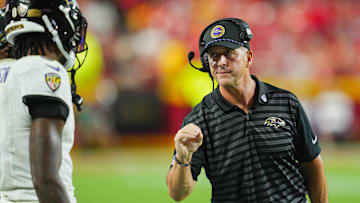Sep 5, 2024; Kansas City, Missouri, USA; Baltimore Ravens head coach John Harbaugh talks with quarterback Lamar Jackson (8) during the second half against the Kansas City Chiefs at GEHA Field at Arrowhead Stadium. Mandatory Credit: Jay Biggerstaff-Imagn Images