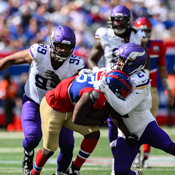 Sep 8, 2024; East Rutherford, New Jersey, USA; New York Giants running back Devin Singletary (26) carries the ball as Minnesota Vikings wide receiver Stephon Gilmore (2) makes the tackle during the second half at MetLife Stadium.  