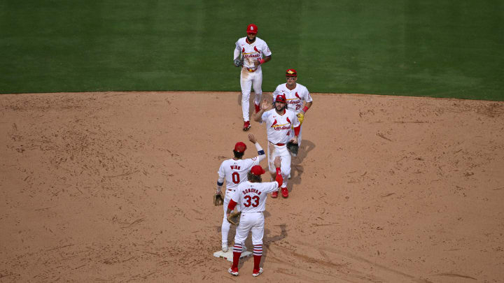 Aug 29, 2024; St. Louis, Missouri, USA;  St. Louis Cardinals left fielder Alec Burleson (41) right fielder Lars Nootbaar (21) and center fielder Victor Scott II (11) celebrate with shortstop Masyn Winn (0) and second baseman Brendan Donovan (33) after the Cardinals defeated the San Diego Padres at Busch Stadium. Mandatory Credit: Jeff Curry-USA TODAY Sports