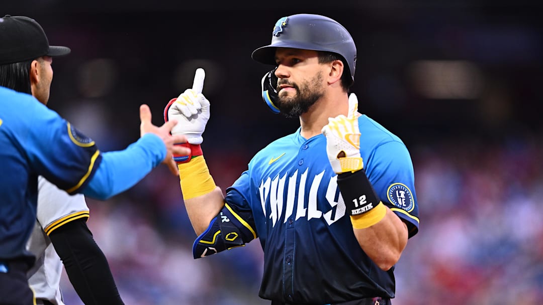 Apr 12, 2024; Philadelphia, Pennsylvania, USA; Philadelphia Phillies designated hitter Kyle Schwarber (12) reacts after hitting a single against the Pittsburgh Pirates in the first inning at Citizens Bank Park.