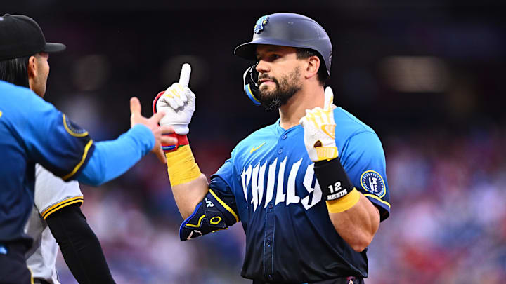 Apr 12, 2024; Philadelphia, Pennsylvania, USA; Philadelphia Phillies designated hitter Kyle Schwarber (12) reacts after hitting a single against the Pittsburgh Pirates in the first inning at Citizens Bank Park.