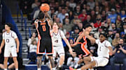 Jan 28, 2025; Spokane, Washington, USA; Oregon State Beavers guard Damarco Minor (0) shoots the ball against Gonzaga Bulldogs guard Michael Ajayi (1) in the second half at McCarthey Athletic Center. Mandatory Credit: James Snook-Imagn Images