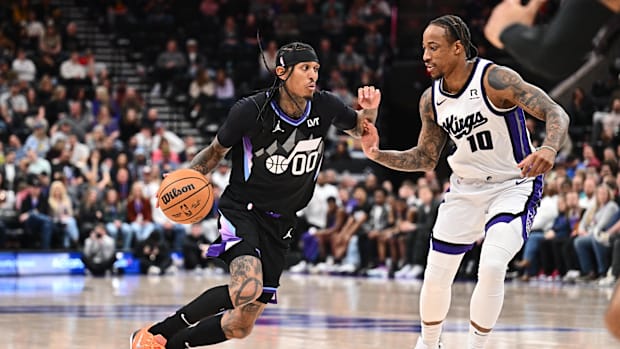 Utah Jazz guard Jordan Clarkson (00) controls the ball while being guarded by Sacramento Kings guard DeMar DeRozan