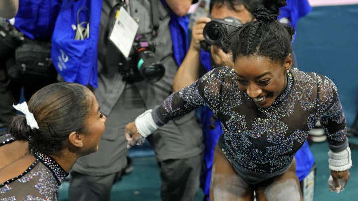 Jul 28, 2024; Paris, France; Jordan Chiles and Simone Biles of the United States react after womenís qualification during the Paris 2024 Olympic Summer Games at Bercy Arena. 