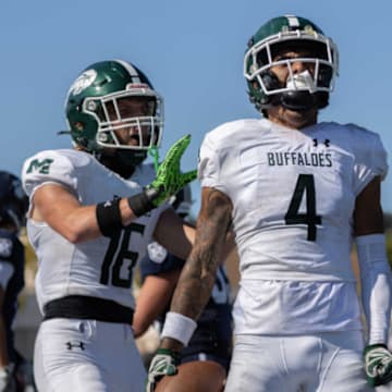 Manteca's Quinn Martinez (4) and Micah Cardoza (16) are all fired up during a big 15-14 win at North Coast Section power Marin Catholic on Sept. 13. Manteca (8-0) moved into the High School On SI Top 25 California football rankings this week. 