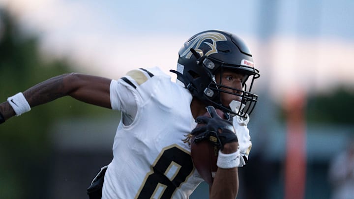 Paramus Catholic's Nehki Martin (8) runs with the ball during a high school football game between St. Peter’s Prep and Paramus Catholic in Jersey City on Friday, Aug. 29, 2025.