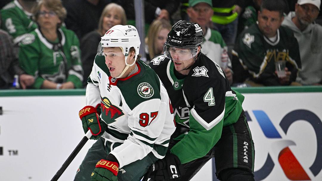 Apr 28, 2026; Dallas, Texas, USA; Minnesota Wild left wing Kirill Kaprizov (97) skates with the puck past Dallas Stars defenseman Miro Heiskanen (4) and scores an empty net goal during the third period in game five of the first round of the 2026 Stanley Cup Playoffs at American Airlines Center. Mandatory Credit: Jerome Miron-Imagn Images
