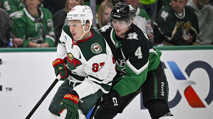 Apr 28, 2026; Dallas, Texas, USA; Minnesota Wild left wing Kirill Kaprizov (97) skates with the puck past Dallas Stars defenseman Miro Heiskanen (4) and scores an empty net goal during the third period in game five of the first round of the 2026 Stanley Cup Playoffs at American Airlines Center. Mandatory Credit: Jerome Miron-Imagn Images