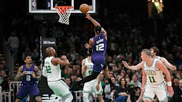 Apr 11, 2025; Boston, Massachusetts, USA; Charlotte Hornets forward Josh Okogie (12) shoots the ball against the Boston Celtics during the first half at TD Garden. Mandatory Credit: Eric Canha-Imagn Images