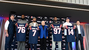 Mar 13, 2025; Foxborough, MA, USA; The New England Patriots hold a press conference at the GP Atrium at Gillette Stadium to introduce free agency additions to the team. (Left to right) New England Patriots head coach Mike Vrabel, offensive tackle Morgan Moses, cornerback Carlton Davis III, owner Robert Kraft, defensive tackle Milton Williams, linebacker Robert Spillane and executive vice president of player personnel Eliot Wolf. Mandatory Credit: Eric Canha-Imagn Images