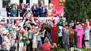 The winning team of Mystik Dan with jockey Brian J. Hernandez cheer in the Winner's Circle for track photographer Kurtis Coady after they won the 2024 Kentucky Derby at Churchill Downs Saturday, May 4, 2024 in Louisville, Kentucky.