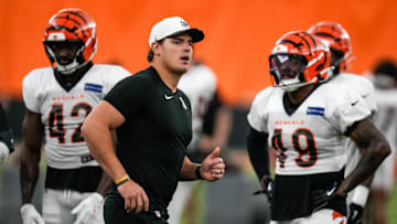 Cincinnati Bengals defensive end Trey Hendrickson (91) assists with a drill during a preseason training camp practice in downtown Cincinnati on Thursday, July 31, 2025.