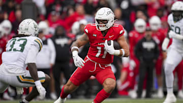 Oct 25, 2025; Cincinnati, Ohio, USA;  Cincinnati Bearcats tight end Joe Royer (11) carries the ball after making a catch against Baylor Bears safety DJ Coleman (33) in the first half at Nippert Stadium. Mandatory Credit: Aaron Doster-Imagn Images