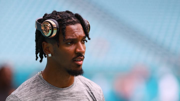 Aug 17, 2024; Miami Gardens, Florida, USA; Washington Commanders quarterback Jayden Daniels (5) looks on from the field before a preseason game against the Miami Dolphins at Hard Rock Stadium. Mandatory Credit: Sam Navarro-USA TODAY Sports