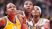 Jun 26, 2025; Indianapolis, Indiana, USA; Indiana Fever forward Aliyah Boston, center, is defended by Los Angeles Sparks forwards Azura Stevens (23) and Rickea Jackson (2) during a free throw in the second half at Gainbridge Fieldhouse. Mandatory Credit: Grace Smith/INDIANAPOLIS STAR-Imagn Images