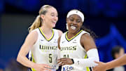 Dallas Wings guard Paige Bueckers and guard Arike Ogunbowale celebrate during the second half against the New York Liberty at College Park Center.