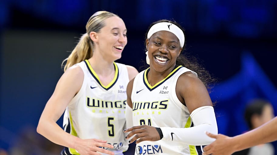 Dallas Wings guard Paige Bueckers and guard Arike Ogunbowale celebrate during the second half against the New York Liberty at College Park Center. | Jerome Miron-Imagn Images