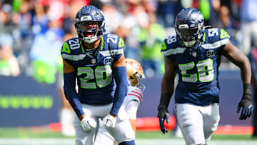 Sep 7, 2025; Seattle, Washington, USA; Seattle Seahawks linebacker Derick Hall (58) and Seattle Seahawks safety Julian Love (20) celebrate after a play during the first half against San Francisco 49ers at Lumen Field. Mandatory Credit: Steven Bisig-Imagn Images
