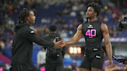 Feb 28, 2025; Indianapolis, IN, USA;  South Carolina defensive back Nick Emmanwori (DB40) greets Texas defensive back Jahdae Barron (DB04)  during the 2025 NFL Combine at Lucas Oil Stadium. Mandatory Credit: Kirby Lee-Imagn Images