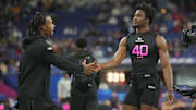 Feb 28, 2025; Indianapolis, IN, USA;  South Carolina defensive back Nick Emmanwori (DB40) greets Texas defensive back Jahdae Barron (DB04)  during the 2025 NFL Combine at Lucas Oil Stadium. Mandatory Credit: Kirby Lee-Imagn Images
