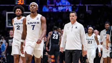 Xavier Musketeers head coach Sean Miller and his team walk for the locker room at the end of the first half of the NCAA Big East Conference basketball game between the Xavier Musketeers and the Georgetown Hoyas at the Cintas Center in Cincinnati on Tuesday, Feb. 4, 2025. Xavier led 30-26 at halftime.