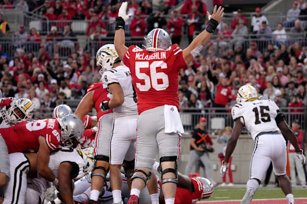 Linemen celebrate touchdown run.