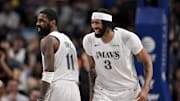 Dallas Mavericks forward Anthony Davis and guard Kyrie Irving celebrate.