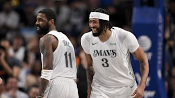 Dallas Mavericks forward Anthony Davis and guard Kyrie Irving celebrate.