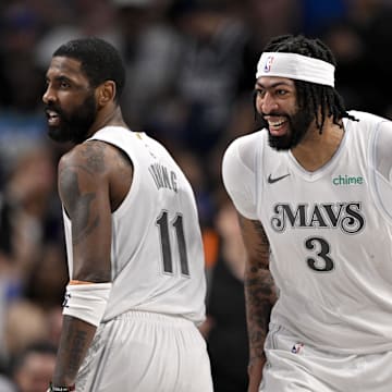 Dallas Mavericks forward Anthony Davis and guard Kyrie Irving  celebrates after Davis dunks the ball during the game between the Dallas Mavericks and the Houston Rockets at the American Airlines Center. Mandatory Credit: Jerome Miron-Imagn Images