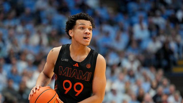 Mar 1, 2025; Chapel Hill, North Carolina, USA;  Miami (Fl) Hurricanes guard Divine Ugochukwu (99) with the ball in the first half at Dean E. Smith Center. Mandatory Credit: Bob Donnan-Imagn Images