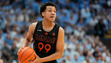 Mar 1, 2025; Chapel Hill, North Carolina, USA;  Miami (Fl) Hurricanes guard Divine Ugochukwu (99) with the ball in the first half at Dean E. Smith Center. Mandatory Credit: Bob Donnan-Imagn Images