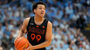Mar 1, 2025; Chapel Hill, North Carolina, USA;  Miami (Fl) Hurricanes guard Divine Ugochukwu (99) with the ball in the first half at Dean E. Smith Center. Mandatory Credit: Bob Donnan-Imagn Images