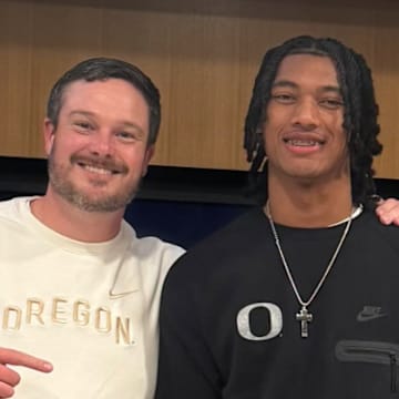 Chris Henry Jr. with Oregon coach Dan Lanning