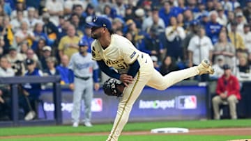 Oct 14, 2025; Milwaukee, Wisconsin, USA; Milwaukee Brewers pitcher Freddy Peralta (51) throws a pitch against the Los Angeles Dodgers in the first inning during game two of the NLCS round for the 2025 MLB playoffs at American Family Field. Mandatory Credit: Benny Sieu-Imagn Images