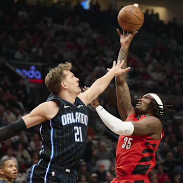 Oct 27, 2023; Portland, Oregon, USA; Portland Trail Blazers center Robert Williams III (35) shoots a basket during the first half against Orlando Magic center Moritz Wagner (21) at Moda Center. Mandatory Credit: Troy Wayrynen-Imagn Images