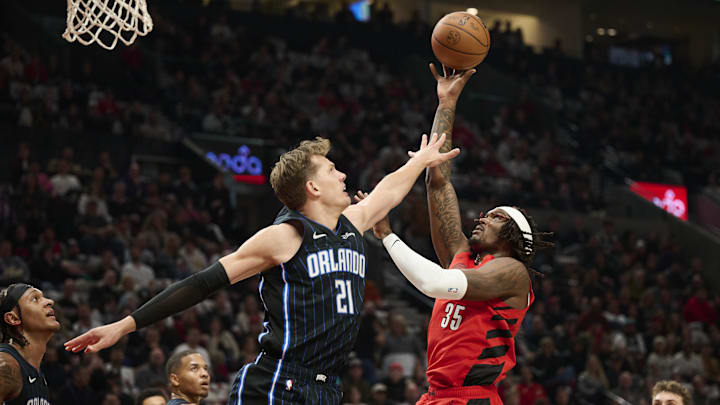 Oct 27, 2023; Portland, Oregon, USA; Portland Trail Blazers center Robert Williams III (35) shoots a basket during the first half against Orlando Magic center Moritz Wagner (21) at Moda Center. Mandatory Credit: Troy Wayrynen-Imagn Images