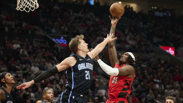 Oct 27, 2023; Portland, Oregon, USA; Portland Trail Blazers center Robert Williams III (35) shoots a basket during the first half against Orlando Magic center Moritz Wagner (21) at Moda Center. Mandatory Credit: Troy Wayrynen-USA TODAY Sports