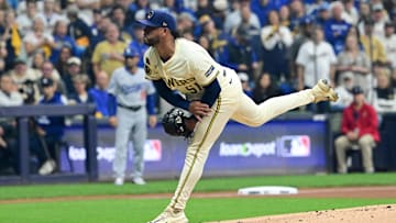Oct 14, 2025; Milwaukee, Wisconsin, USA; Milwaukee Brewers pitcher Freddy Peralta (51) throws a pitch against the Los Angeles Dodgers in the first inning during game two of the NLCS round for the 2025 MLB playoffs at American Family Field. Mandatory Credit: Benny Sieu-Imagn Images