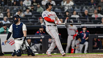Jun 8, 2025; Bronx, New York, USA; Boston Red Sox designated hitter Rafael Devers (11) reacts after hitting a solo home run against the New York Yankees during the ninth inning at Yankee Stadium. Mandatory Credit: John Jones-Imagn Images