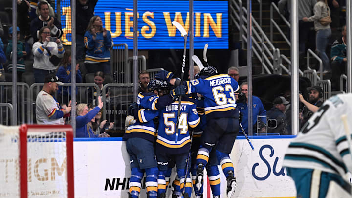 Mar 26, 2026; St. Louis, Missouri, USA; The St. Louis Blues celebrate after beating the San Jose Sharks in overtime at Enterprise Center. Mandatory Credit: Joe Puetz-Imagn Images